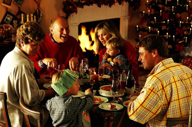 Family eating Christmas dinner natale